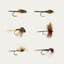 Assorted brown and tan fly fishing lures, foam-bodied nymphs with barbed hooks