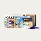 Saltwater fly assortment box with multiple fly packs and a tapered leader
