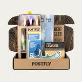 Open Postfly assortment box with fly packs and a tapered leader package
