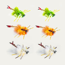 Assorted crab fishing flies with green, orange, and white feather bodies