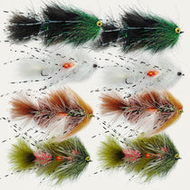 Assorted feather streamer flies with bead eyes in green, white, orange, and brown.