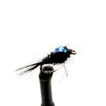 Black fly nymph lure with blue wing accent and barbed hook, close-up