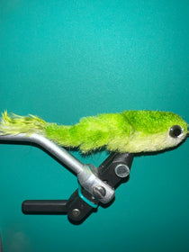 Green fuzzy fishing lure with metal hook and black-and-silver mount