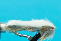 Hare Sculpin fly streamer with gray-green body, white top, red eye, fluffy tail
