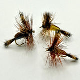 Dry fly fishing lure with orange and brown feather hackle, tied on an eye hook