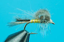 Olive dubbing emerger fly with gold bead and olive wing, on a metal hook