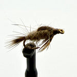 Brown feather fishing fly with gold hook on black holder