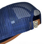 Blue mesh trucker cap with side panel and brown leather logo patch
