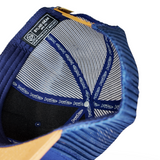 Blue trucker cap interior mesh with size tag and stitched emblem