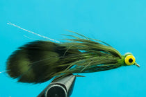 Fishing lure fly with dark olive body, green/blue feathers, and yellow eye