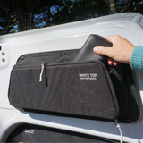 Black upper rear door storage panel with zippered pocket, angled install view (pair)