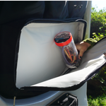 Black storage panel pocket holding bottled drinks and other small items