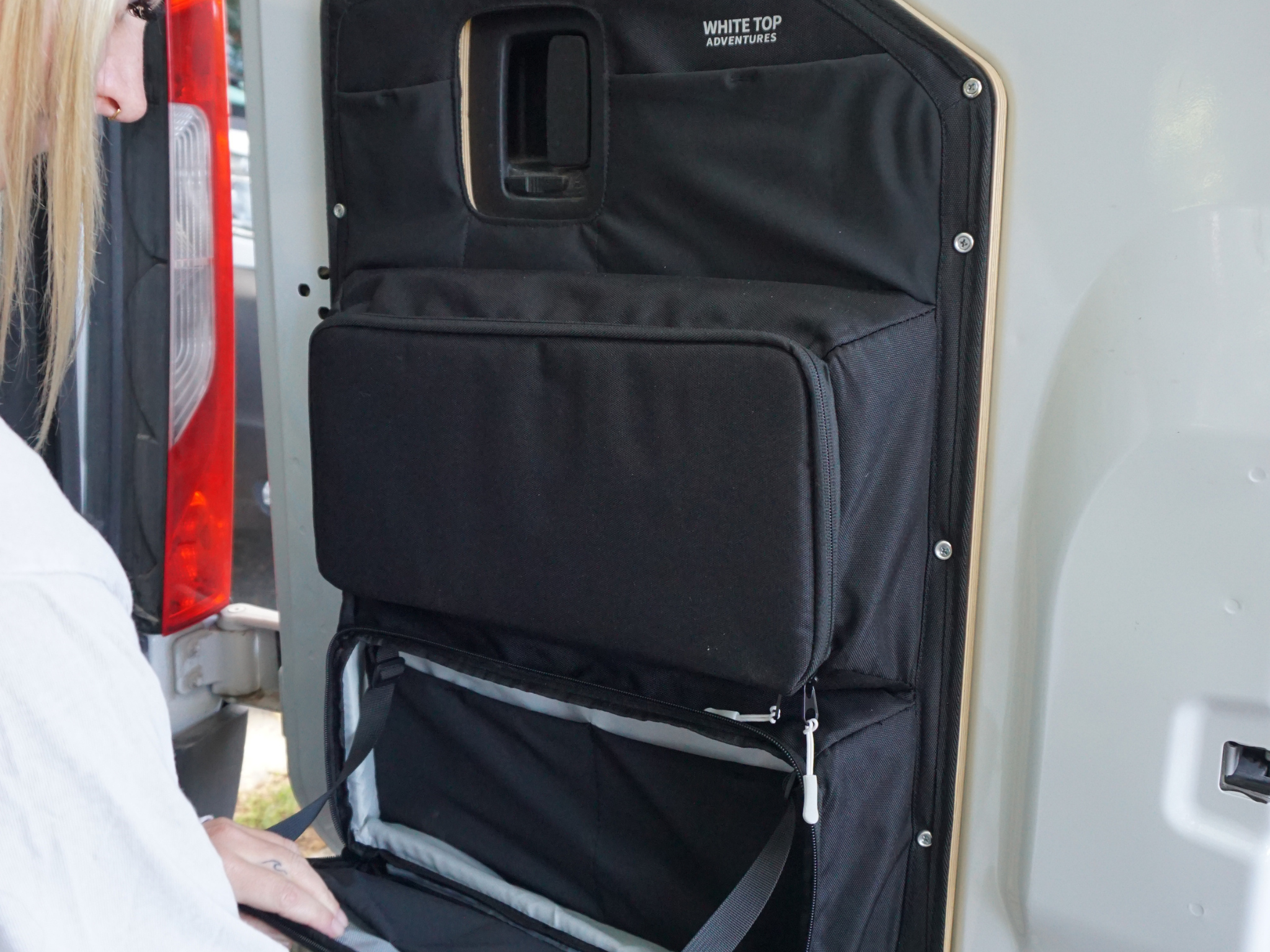 Mercedes Sprinter rear door storage panel, black fabric with large flap pocket and zipper closures
