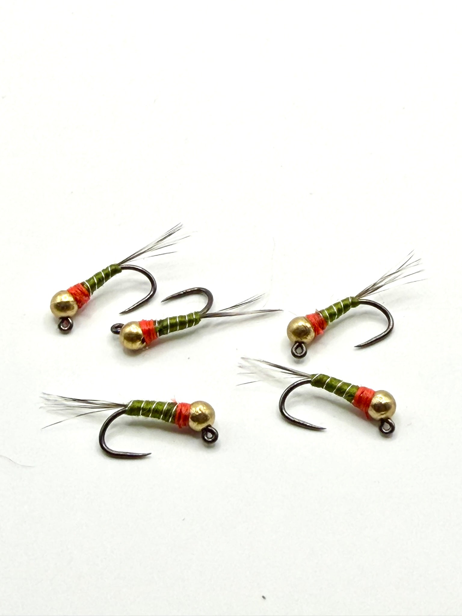 Set of bead-head fishing flies with gold beads, green/red striped bodies, barbed hooks