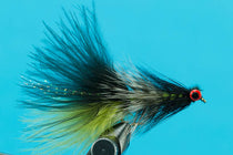 Feather fly fishing lure with green and black body and red eye on hook