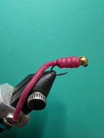 Squirminator Bloodworm red fishing lure with black head and barbed hook