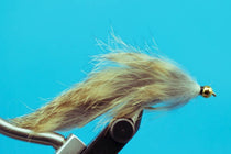 Squirrel leech fishing lure with gold beadhead and tan furry body