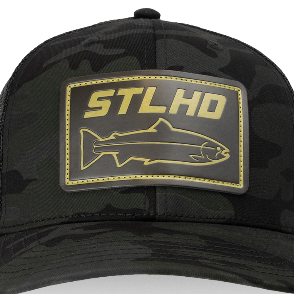 Men's camo flex-fit cap with black brim and large STLHD logo patch