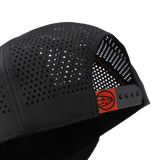 Black trucker cap side with perforated panels and orange adjustable strap