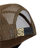 Tan mesh back trucker cap with black adjustable strap and side eyelets