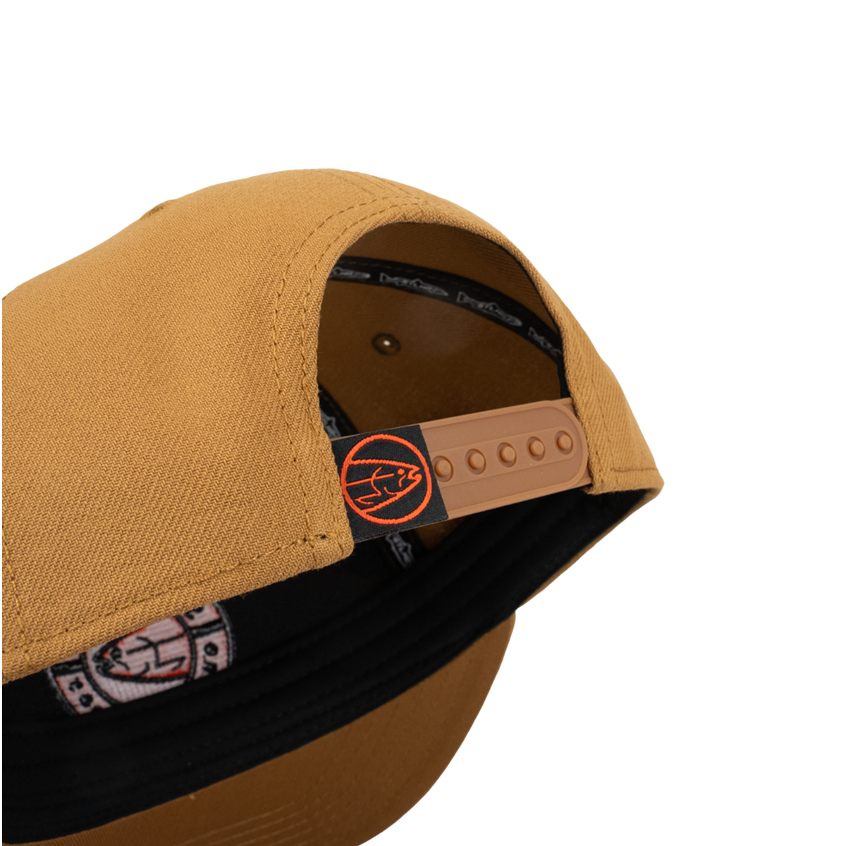 Tan cap with open side showing interior label and orange adjustable strap