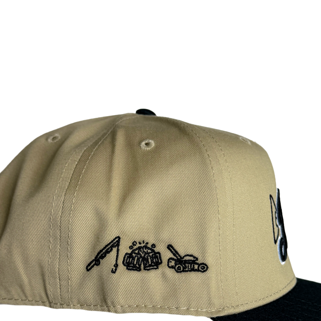 Back view khaki dad hat with small stitched text and embroidered icon