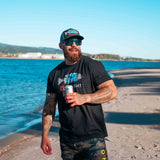 Men’s black T-shirt worn on beach, Coors Light fish and mountain front graphic