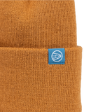 Brown knit beanie with small blue square logo patch at cuff