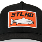 Black flex-fit cap close-up of orange embroidered logo patch and fish graphic