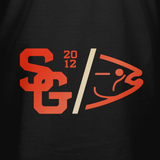 Black varsity T-shirt close-up: orange and cream chest logo graphic.
