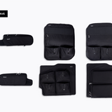 Black rear door storage panels set with multiple zippered pockets and compartments