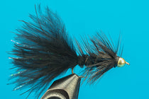 Dark feather fly fishing lure on tungsten jig hook