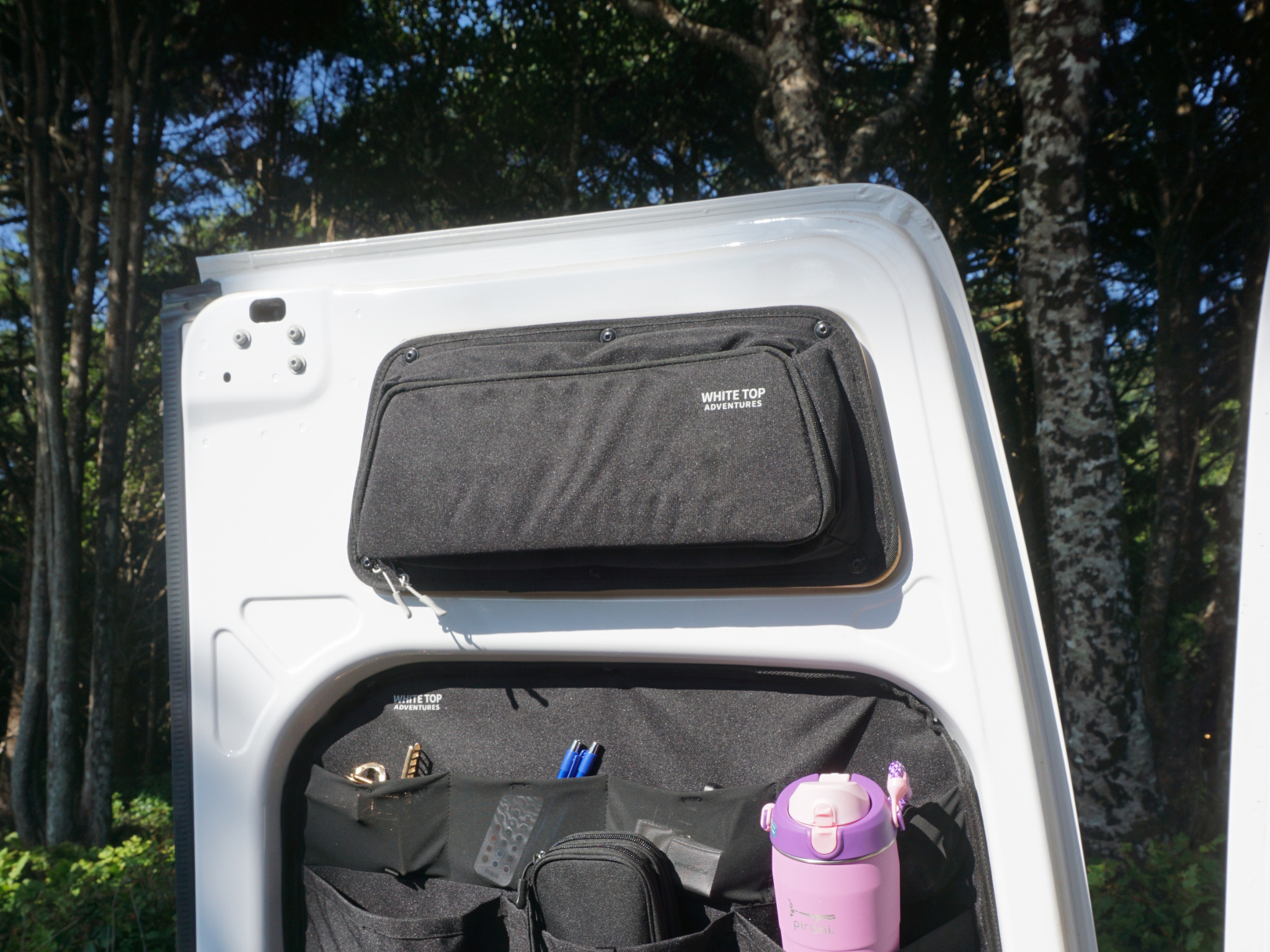 Dark fabric upper rear door storage panels with zippers installed on van doors (pair)