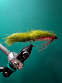 Olive zonker fishing fly with yellow-gray body and marabou tail on black hook